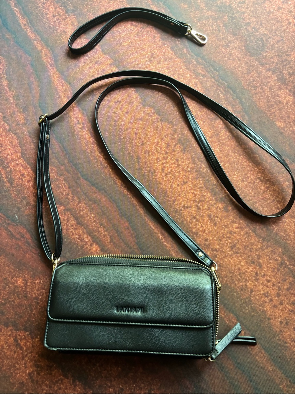 Lanyani Black Leather Crossbody Wristlet with Gold Hardware